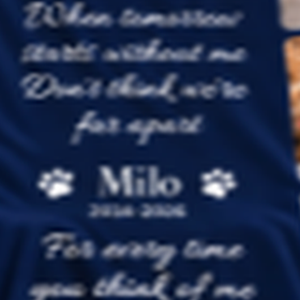 Close-up of the memorial verse and the name Milo printed on the navy pet memorial blanket