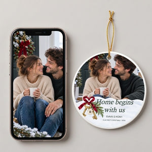 Personalized first home Christmas ornament beside the phone photo it was made from, both lying on a pale surface