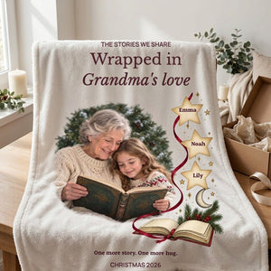 Personalized fleece blanket for Grandma folded beside an open kraft gift box lined with ivory tissue paper